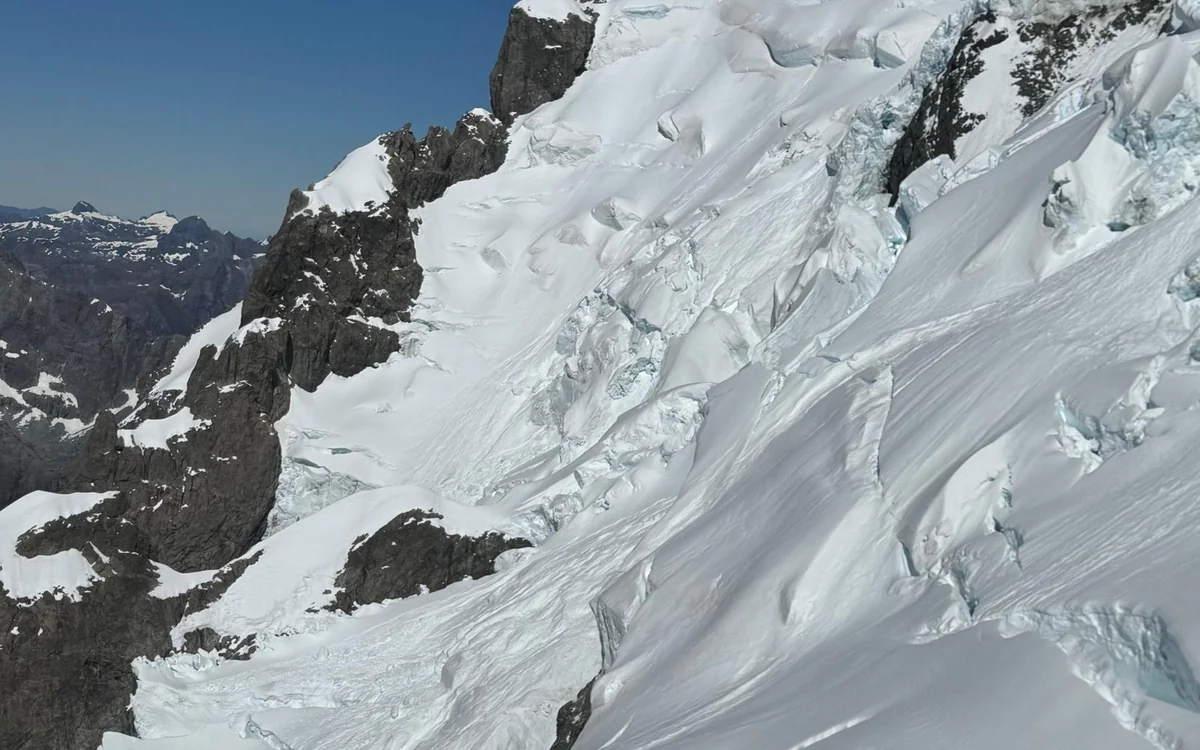Glacial ice and crevasses seen from a helicopter window in the Southern Alps
